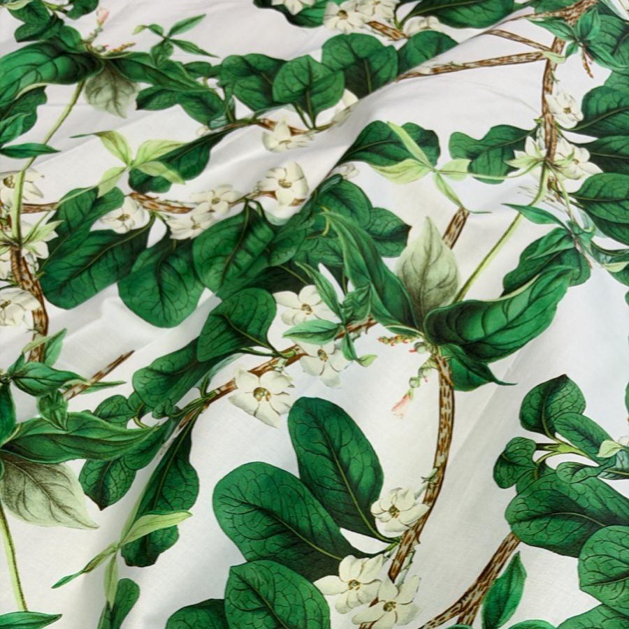 Puuvill stretch, valgel roheliste lehtedega oksad ja õied, laius 144cm